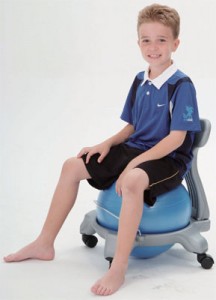 kid sitting on Ball Chair
