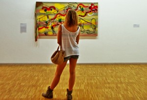 woman looking at painting 
