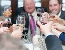 people holding wine glasses 